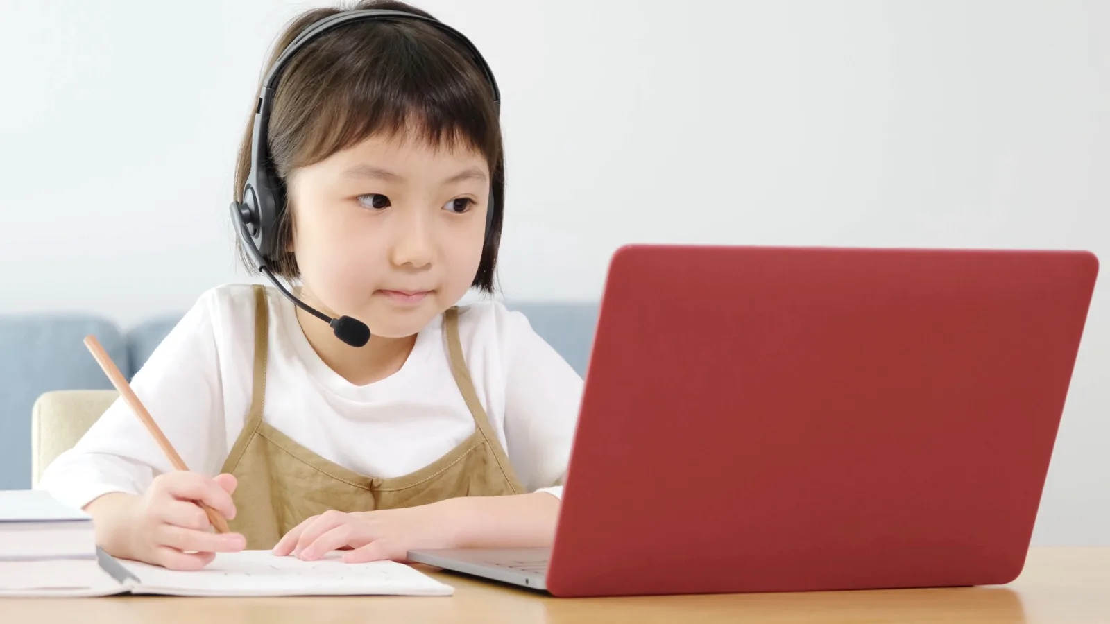 young asian girl studying at home